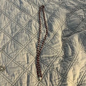 Virgins Saints & Angels ( VSA) burgundy bead Necklace